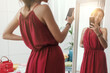 © StockPhotoPro - Woman taking selfies with her new dress