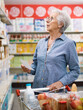 © StockPhotoPro - Senior lady doing her shopping at the supermarket