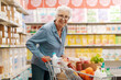 © StockPhotoPro - Portrait of a senior woman at the supermarket