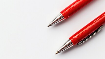 Wall Mural - Two red pens on a white background