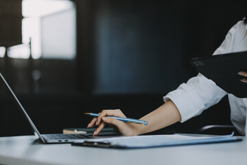 Wall Mural - Businesswoman working at office with documents on desk, doing planning analyzing the financial report, Asian woman business plan investment, finance analysis concept