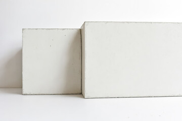 Poster - Two White Concrete Cubes on a White Background