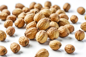 Canvas Print - Close-up of Dried Coriander Seeds on White Background