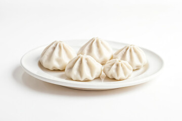 Wall Mural - Close-up of Steamed Buns on White Plate