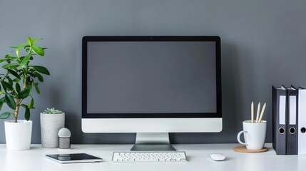 Close up Minimalistic workspace with computer modern designer desktop with blank computer screen, office equipment decorations on table. Mock up