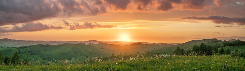 Wall Mural - Evening rural landscape, the setting sun, sunset, meadows and hills, panoramic view