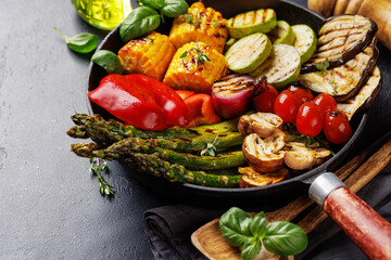 Wall Mural - Assorted grilled vegetables on a frying pan, showcasing a colorful meal