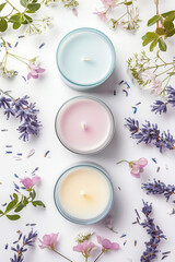 Poster - Top down view of colorful candles  and flowers on a white background. Created with Generative AI technology.