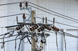 © MMxeon - Close view of high voltage post, High voltage tower, show with high voltage construction and power lines, with blue sky background.