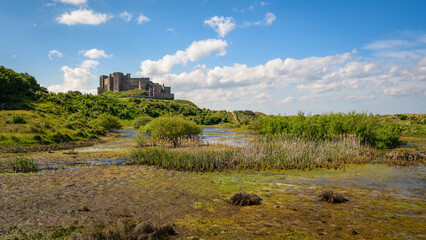 Wall Mural - bowl hole medieval graveyard in bamburgh dunes. first revealed by a violent storm in the 19th centur