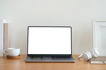Aufkleber - Laptop with blank white screen, books, coffee cup and picture frame on wooden table.