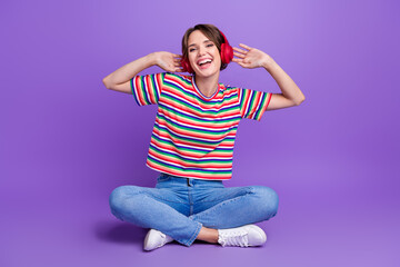 Poster - Photo of glad positive girl enjoying weekend listening music quality sound isolated on violet color background