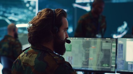 Poster - Reconnaissance department operator gathering information crucial for a national safety mission, transmitting intelligence to the troops. Telecommunications personnel in command post. Camera A.