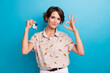 © deagreez - Photo of attractive girl hold new house key demonstrate okey symbol approval isolated on blue color background