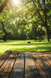 © Shahid - wooden table Close up with blurry trees generated.AI