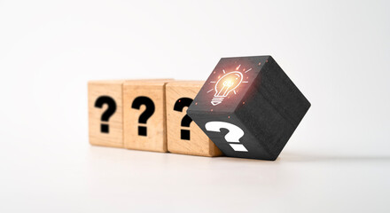Fototapete - Flipping of glowing lightbulb and question mark on black wooden cube for creative thinking idea problem solving and solution concept.