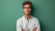 © Saowanee - The young man stood out wearing glasses. green background scene This emphasizes his stylish and smart appearance. Create an attractive and memorable image.