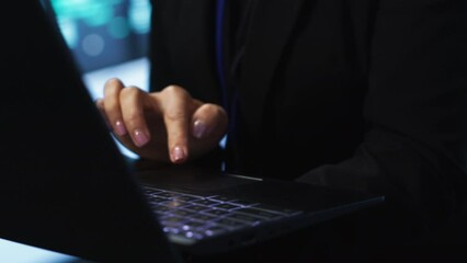 Poster - Programmer in server hub checking recovery plan on laptop, monitoring energy consumption across mainframes. Close up of employee using notebook in data center, ensuring rigs are functioning, camera A