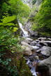 © Oleh - Stormy, picturesque waterfall. Aerial view of a picturesque mountain waterfall flowing like a stormy stream into a stone bowl