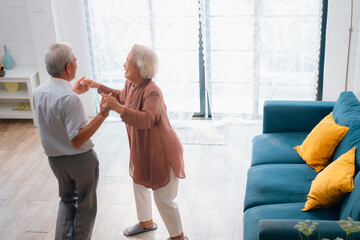 Wall Mural - Celebrating Retirement: Elderly Couple Embrace Love and Happiness at Home, Fun-filled Life of Dancing, Smiling, and Bonding Together, Cherishing Family and Romance in Their Golden Years