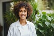 © CojanAI - Smiling portrait of young female doctor or nurse in a medical office