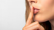 © slonme - Close-up of Woman's Lips with Finger on Mouth Gesture