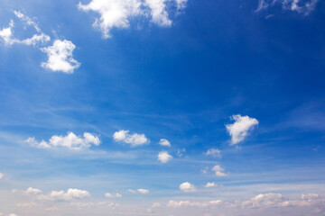Wall Mural - white cumulus clouds on a blue sky. wonderful nature background of atmosphere condition in morning l