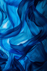 Wall Mural - Abstract blue silk waves creating a smooth, flowing pattern. The artistic design is soothing and elegant