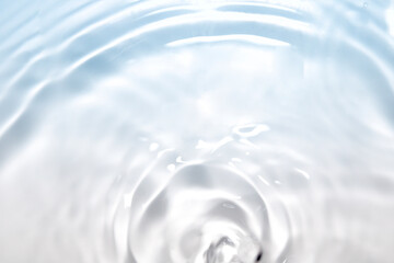 Wall Mural - the clear blue surface of the water gradients from light to dark.