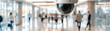 © artitwpd - A security camera is monitoring a busy hallway.