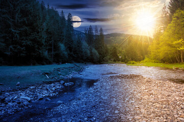 Wall Mural - landscape with river at summer solstice. mountainous scenery with forest on the shore beneath a sky with sun and moon. shallow water. day and night time change concept. pagan holiday