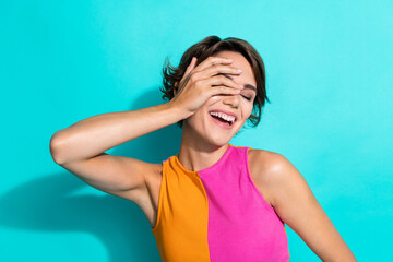 Wall Mural - Photo of dreamy cheerful lady dressed colorful top arm cover closed eye laughing isolated turquoise color background