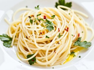 Wall Mural - Simple Spaghetti with Olive Oil and Parsley. A close-up of a plate of simple spaghetti garnished with olive oil, chopped parsley, and red pepper flakes.