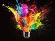 © Business Pics - Creative light bulb explodes with colorful paint and splashes on a black background. Think differently creative idea concept
