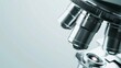© Thanakrit - Highdefinition closeup of a sleek microscope lens on a pristine white background, leaving room for text, ideal for scientific research and laboratory presentations