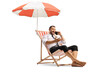 © Ljupco Smokovski - Businessman sitting on a beach chair under umbrella and making a phone call