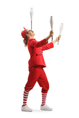 Poster - Entertainer in a red suit holding juggling club on nose