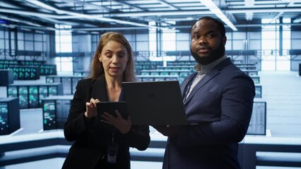 Poster - manager in data center supervising worker running error checking utilities to fix errors. supervisor