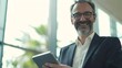 © The Little Hut - Portrait of happy smiling 45 years old business man executive standing in office using digital tablet Middle aged businessman manager wearing suit glasses working on professional finan : Generative AI