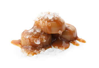 Wall Mural - Yummy candies with caramel sauce and sea salt isolated on white