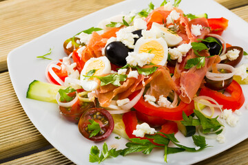 Sticker - Traditional dish of Bulgarian cuisine shepherd's salad with fresh vegetables, salmon and quail eggs