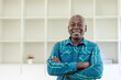 © David - Portrait, corporate and senior man with arms crossed, smile and formal in a workplace,
