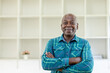 © David - Portrait, corporate and senior man with arms crossed, smile and formal in a workplace,