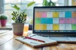 © Thanyaporn - A close-up of a digital calendar on a laptop screen, showing a detailed weekly schedule. Time blocks are color-coded for different tasks, emphasizing the importance of visual organization in time