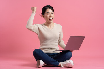 Wall Mural - Image of beautiful Asian woman posing on a white background