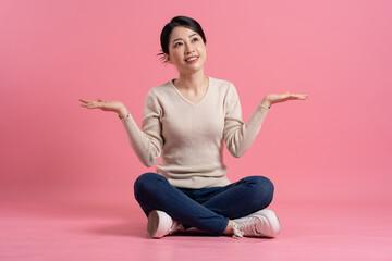 Wall Mural - Image of beautiful Asian woman posing on a white background