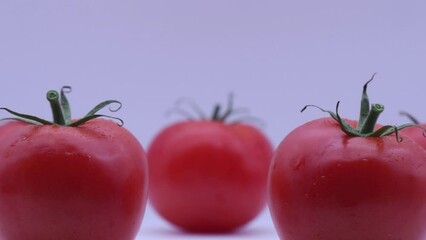 Wall Mural - Fresh red cherry tomatoes isolated on white background. 