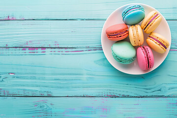Poster - French macaron cookies in assorted colors on a white plate Stock Photo with copy space Isolated on white background