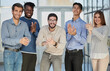 © Katsiaryna - Successful business group applauding at the office
