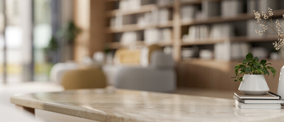 Poster - A close-up image of a neutral marble coffee table in a contemporary spacious living room.